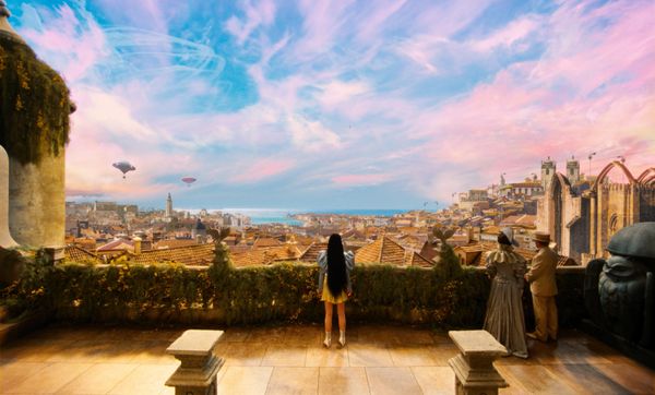 A still from Poor Things, where Bella looks out over Lisbon.