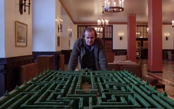 Jack Nicholson's Jack Torrance overlooks the Overlook's hedge maze while looking less unpleasant than average.